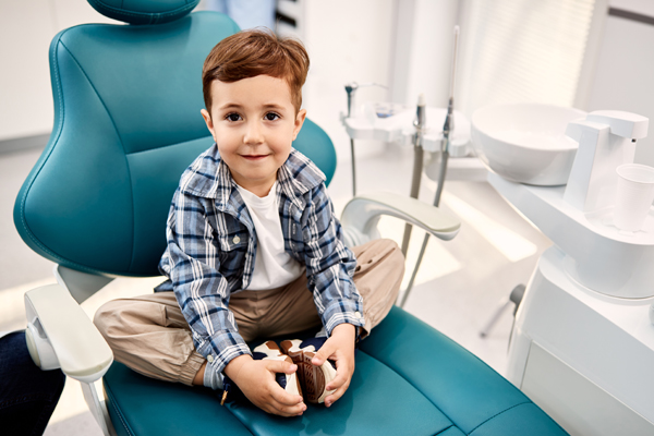 Should I Take My Child To A Kid Friendly Dentist In Tulare For White Spots On Teeth?